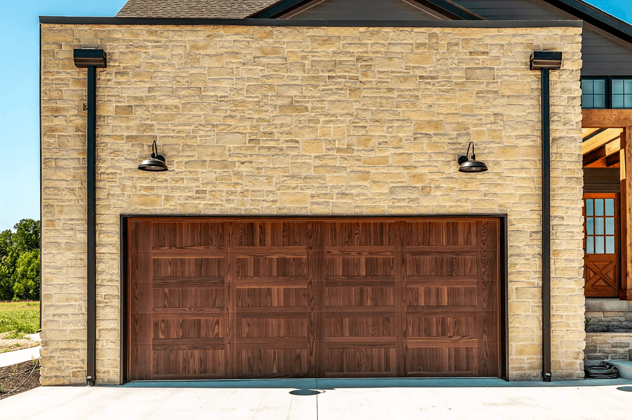 stamped carriage house garage door in wood tone