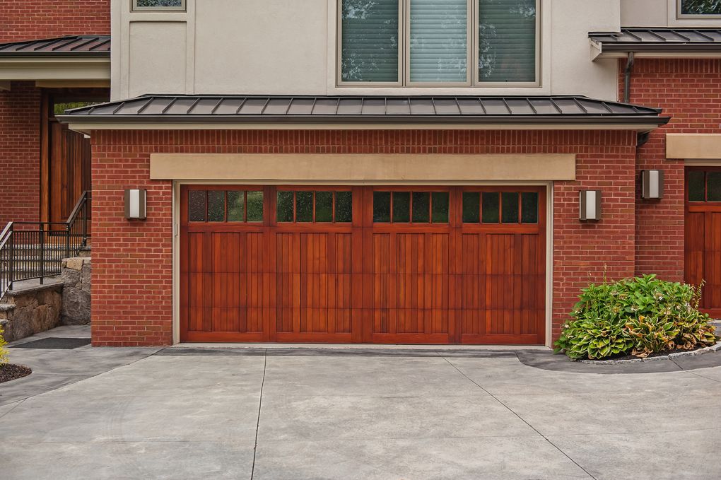 wood overlay carriage house garage door with madison window inserts