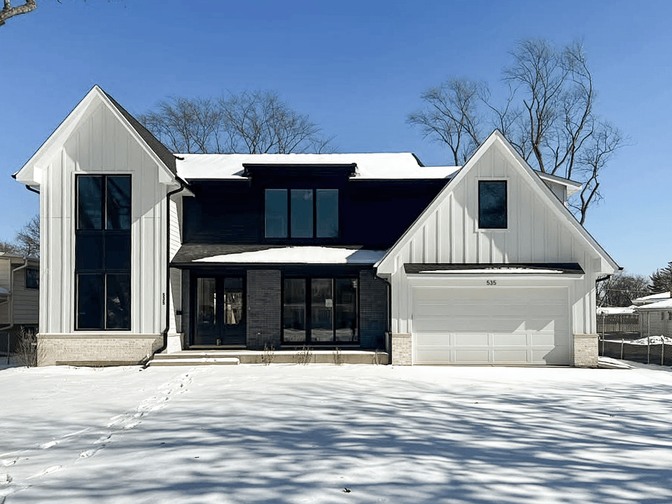 white recessed panel garage door on farmhouse exterior
