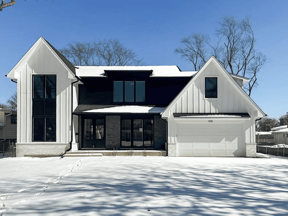 white recessed panel garage door on farmhouse exterior