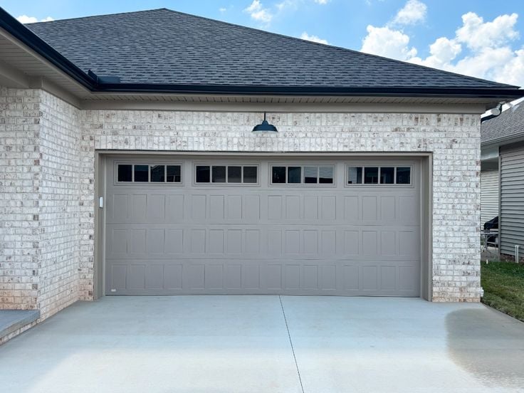 Sandstone Stamped Shaker Panel Garage Door - ranch style
