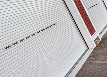 Angled photo of white commercial door