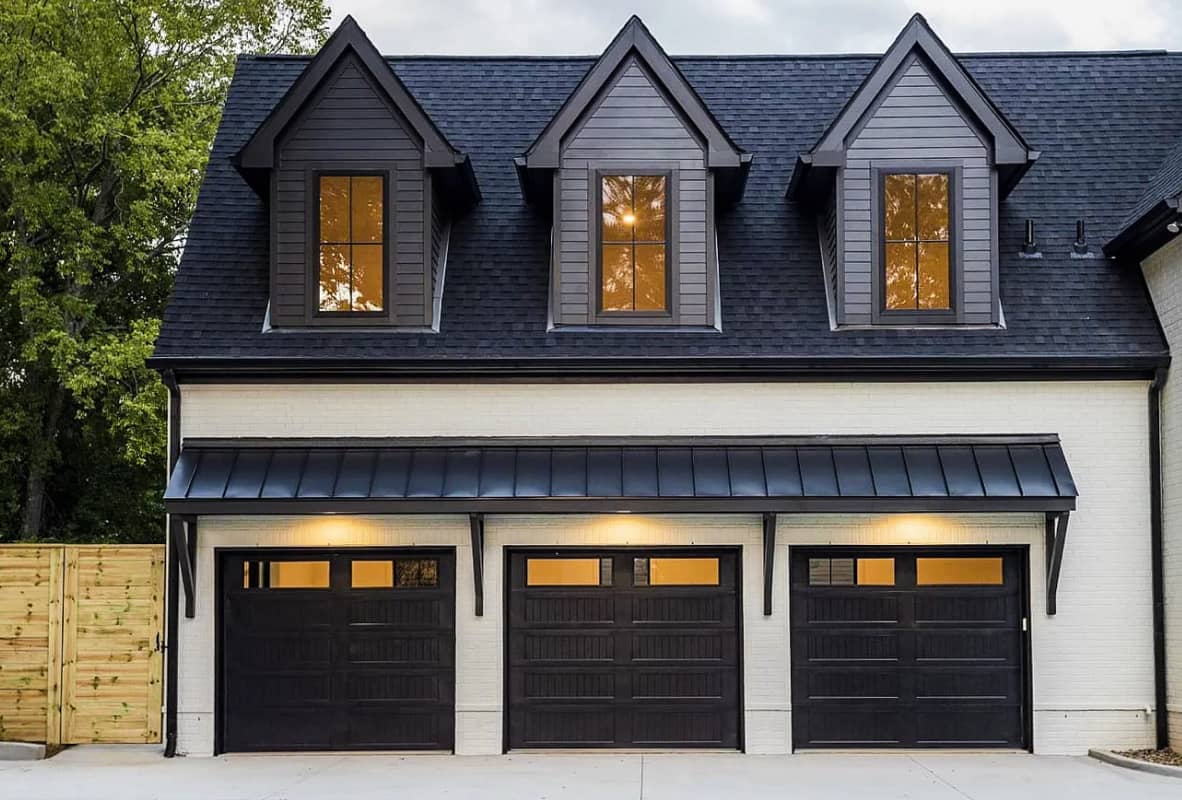 Stamped carriage house black garage doors 