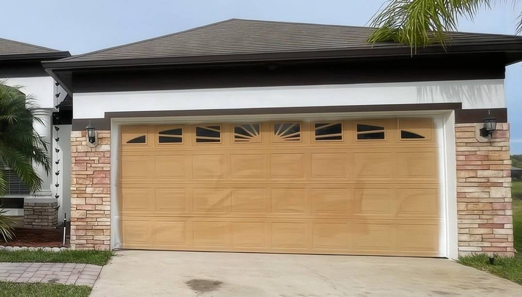 before - brick garage with light brown door