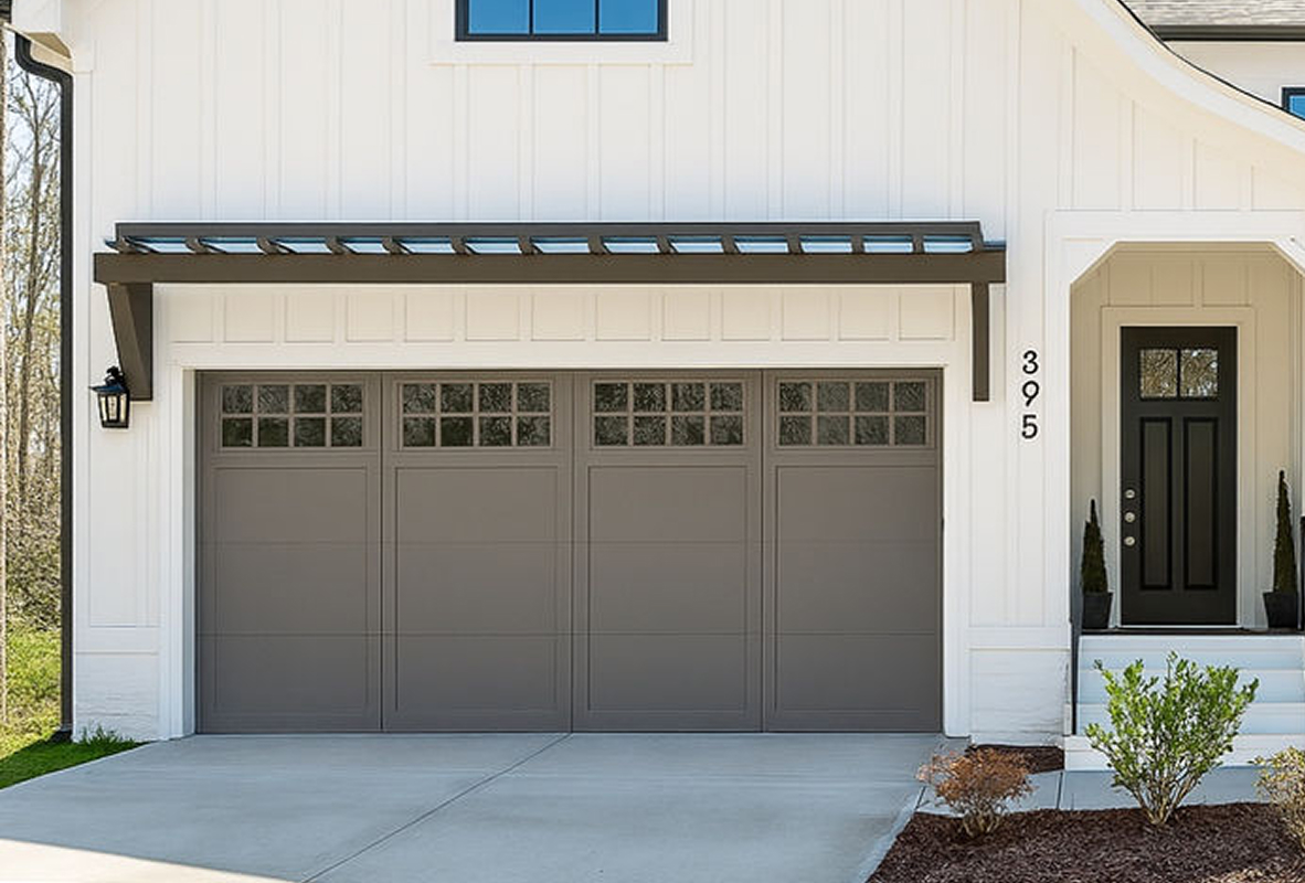 White house with a bronze garage door