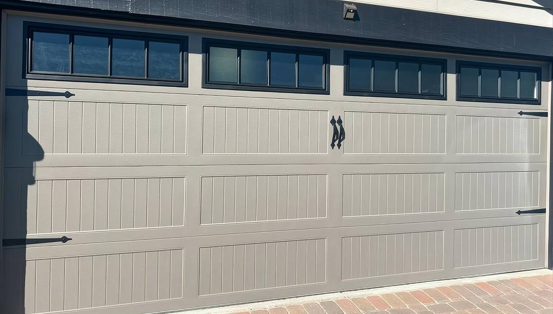 after - wide stamped carriage house bronze garage door