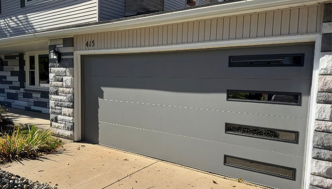 after - brick house with skyline flush graphite gray garage door