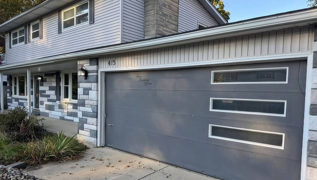 before - brick house with gray door