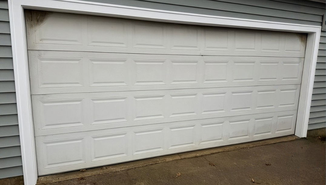 before - gray house with white door