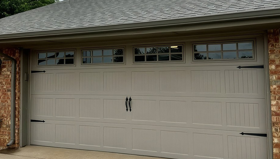 after -  brick house with a new stamped carriage house sandstone garage door