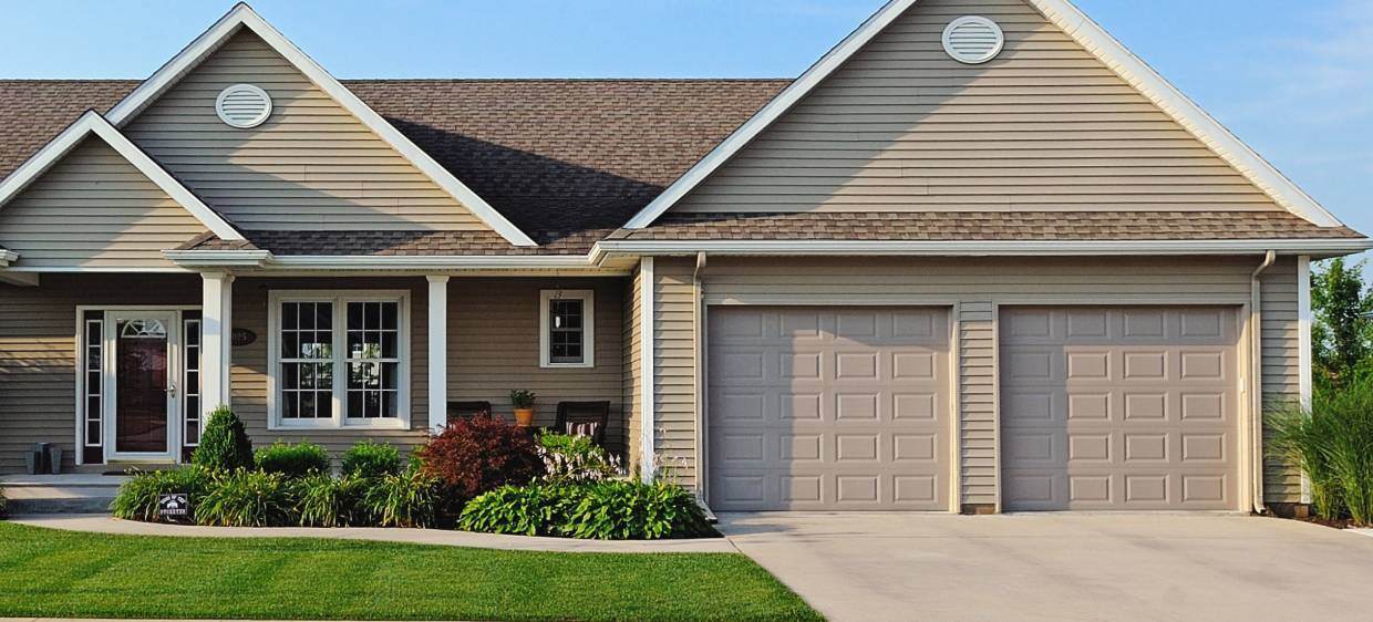 Raised panel garage door in sandstone