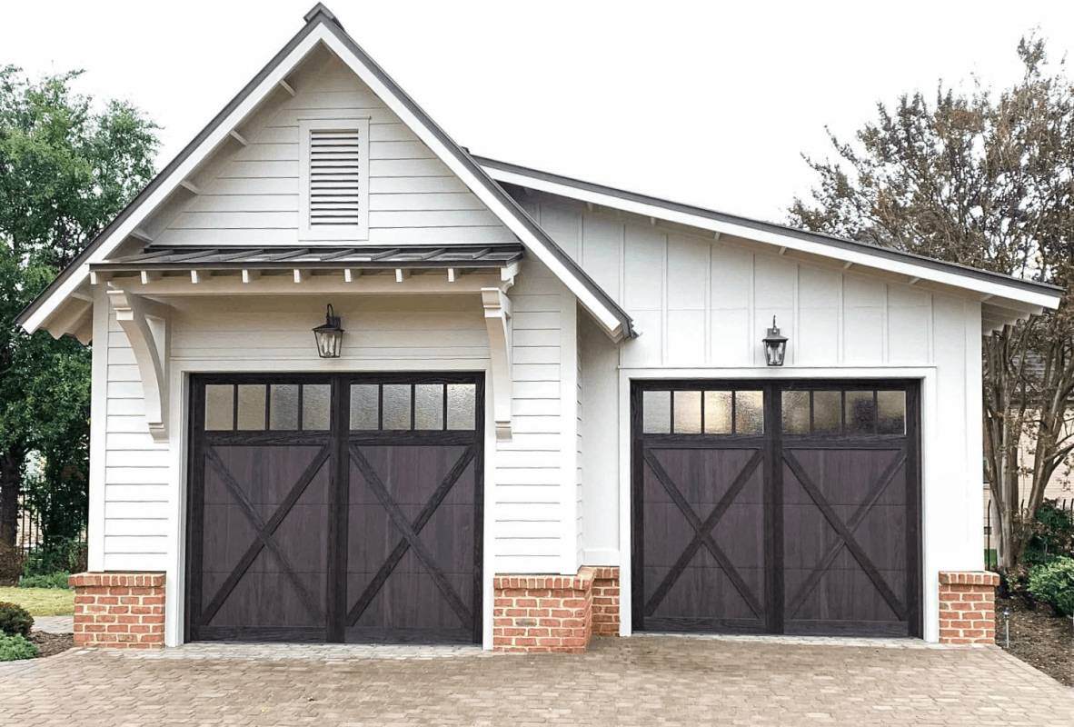 Shoreline garage door in walnut white house