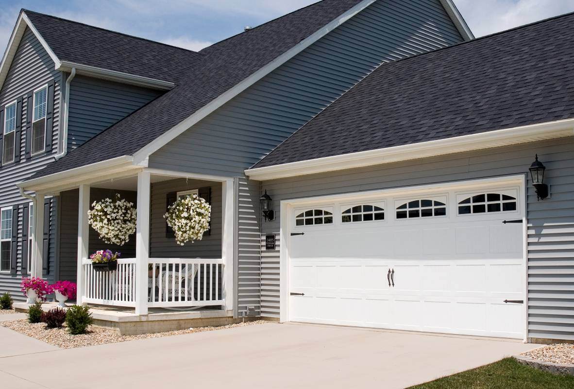 Stamped carriage house garage door in white
