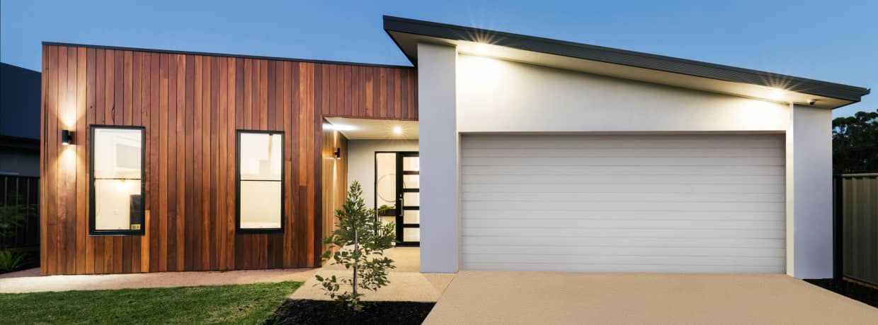 modern-white-garage-door-wooden-clad-house