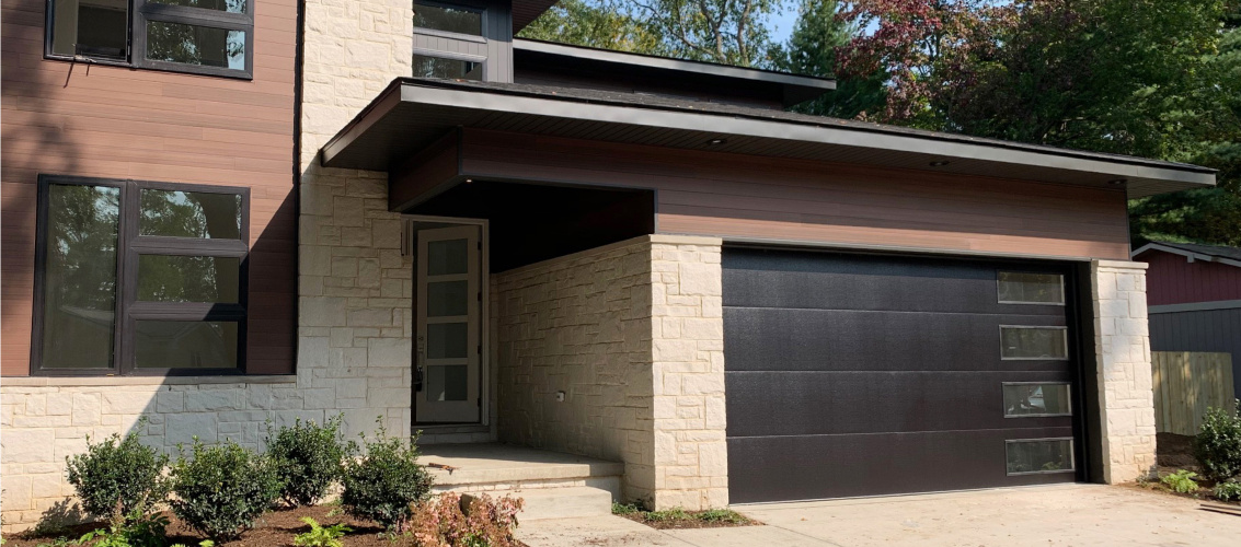 Skyline flush garage door in black mid-century house