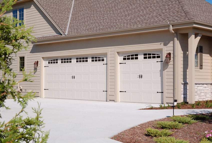 Stamped carriage garage doors