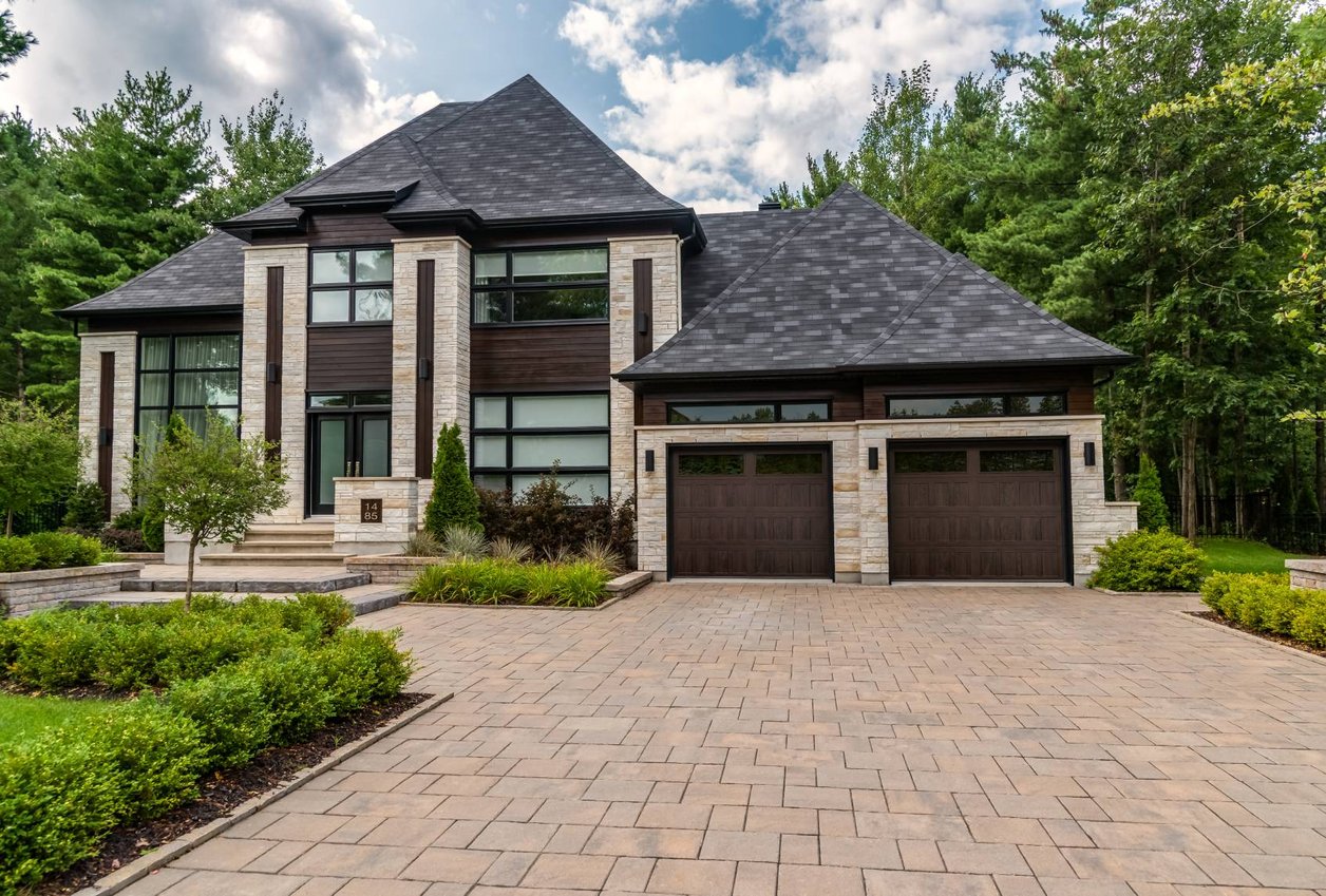 C.H.I. Stamped Shaker garage doors in a contemporary home setting