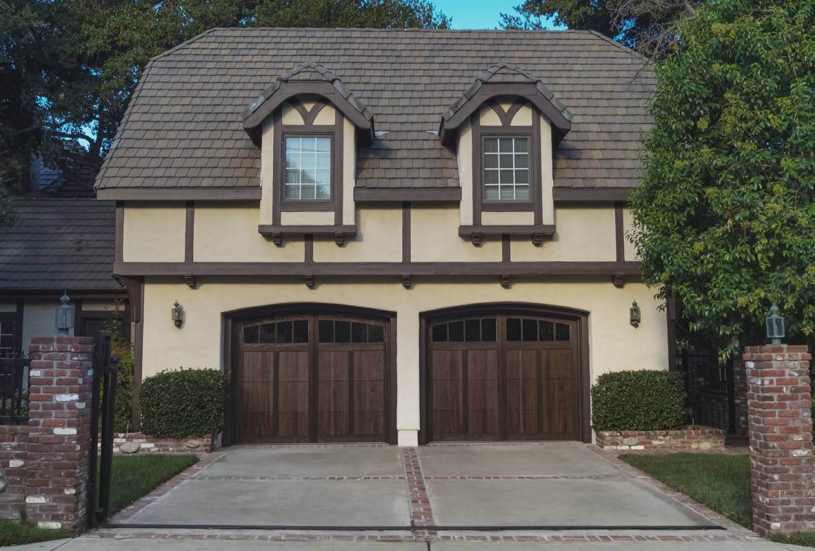 Shoreline garage door in walnut tudor style