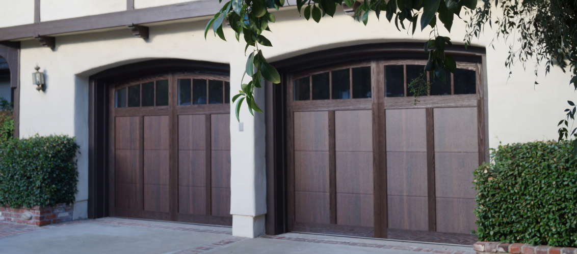 Shoreline garage doors in walnut close up tudor style