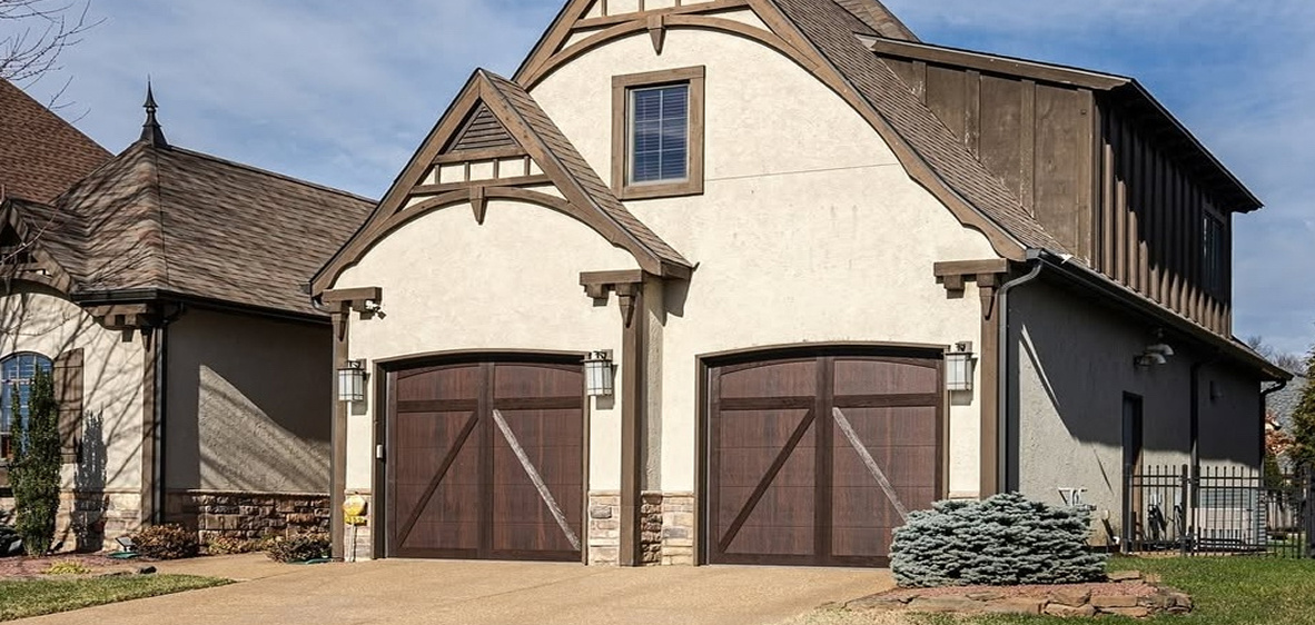 White and brown tudor style house-featured