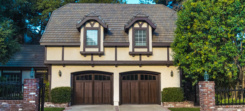 Overlay carriage house with tudor style house