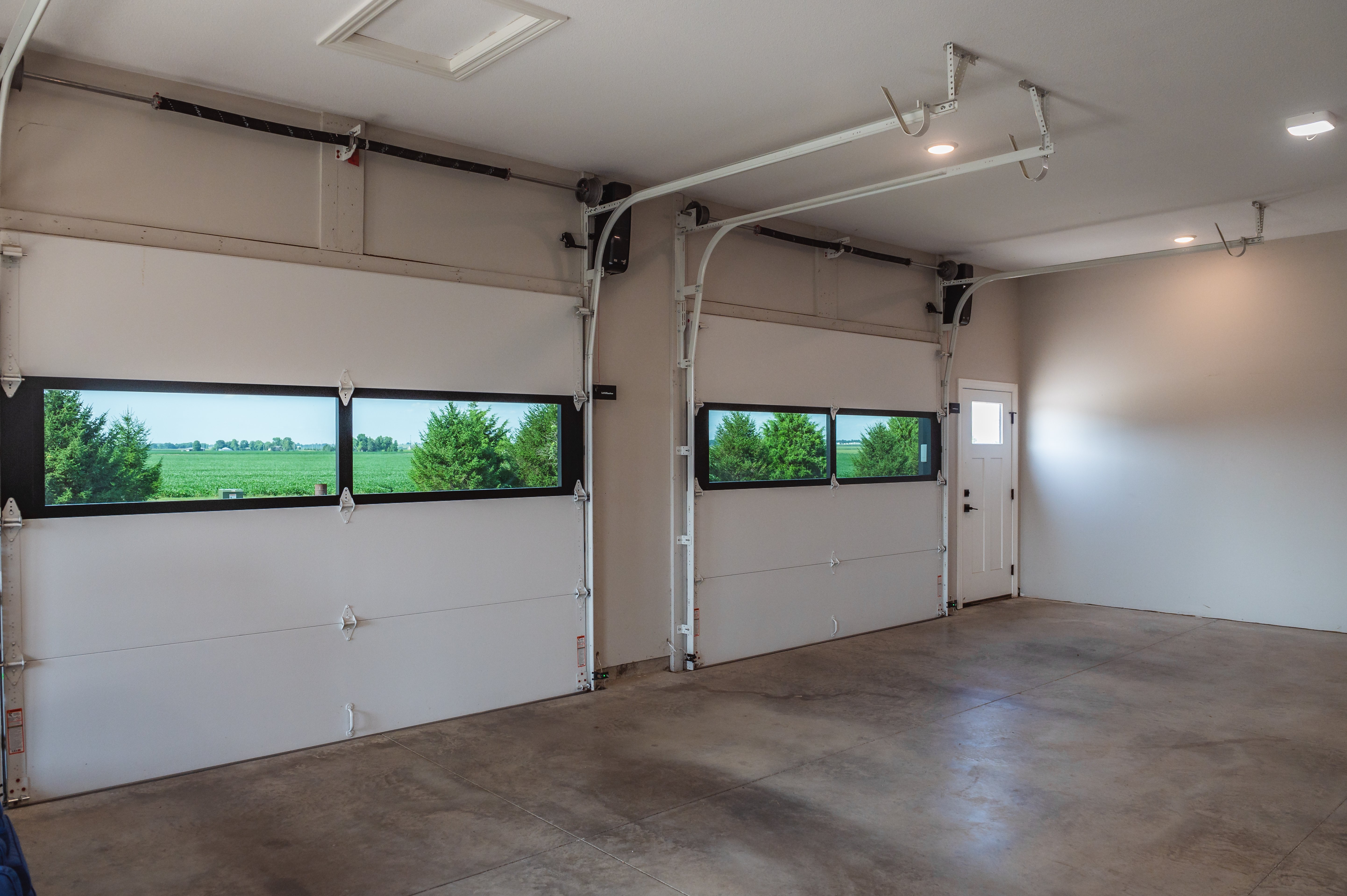 Natural light and outdoor views through Infinity windows from inside the garage