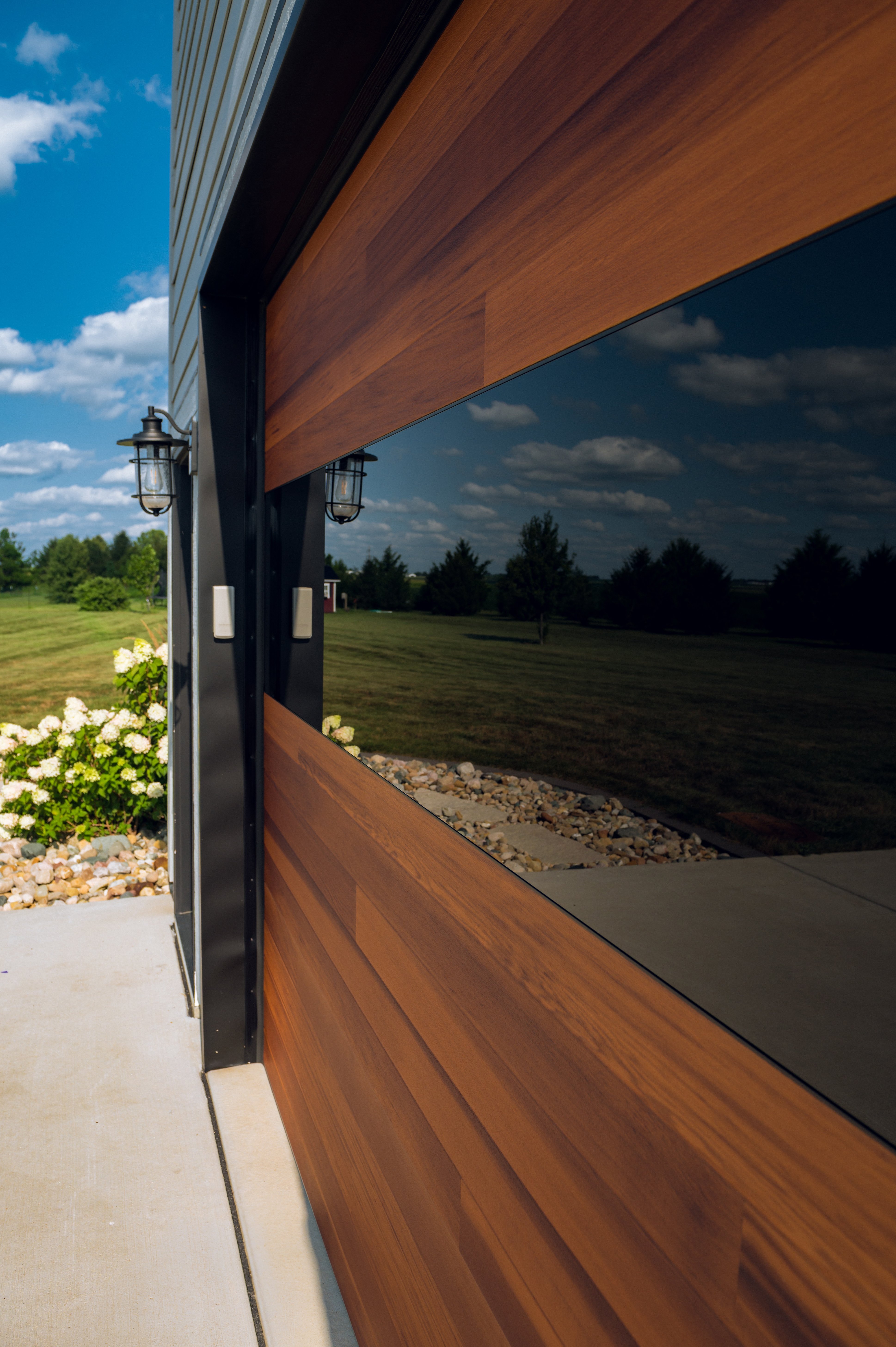 Infinity window tinted glass detail on the exterior of a Cedar Planks garage door