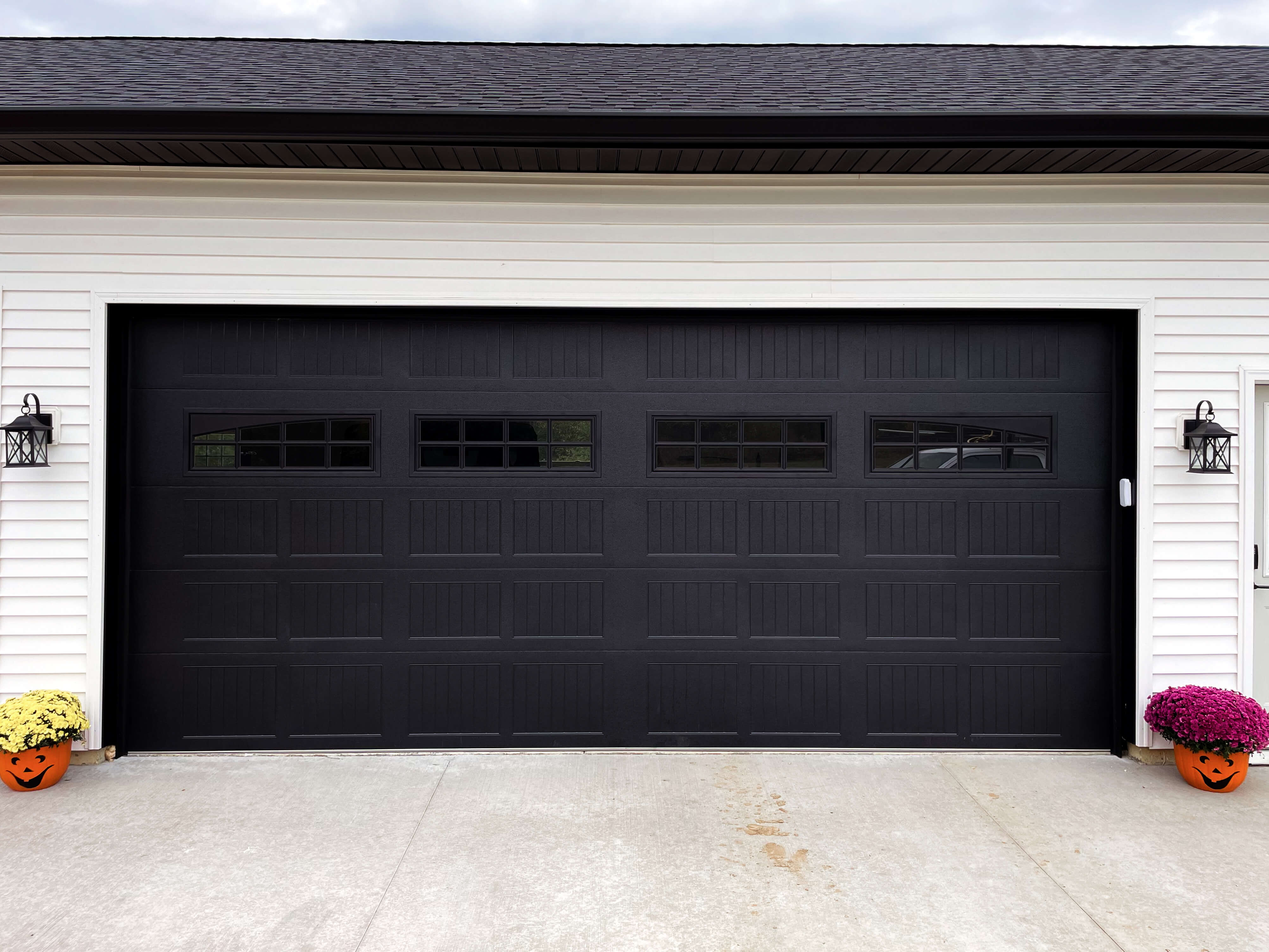 black stamped carriage house garage door