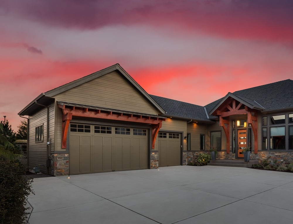 luxury house with new garage and sunset background