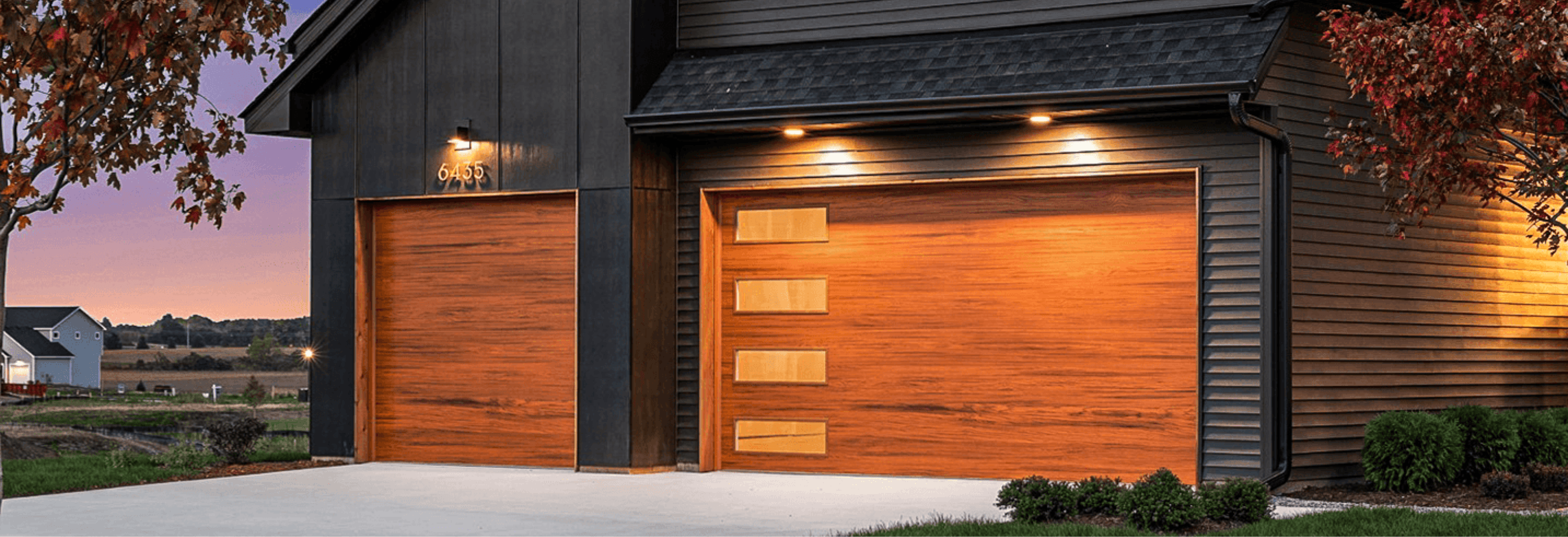 cedar skyline flush garage doors on dark home