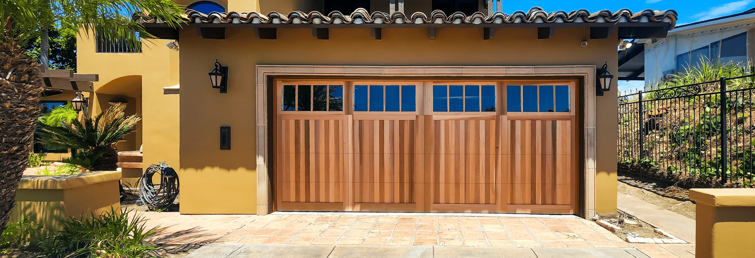 wood overlay garage door with top row windows