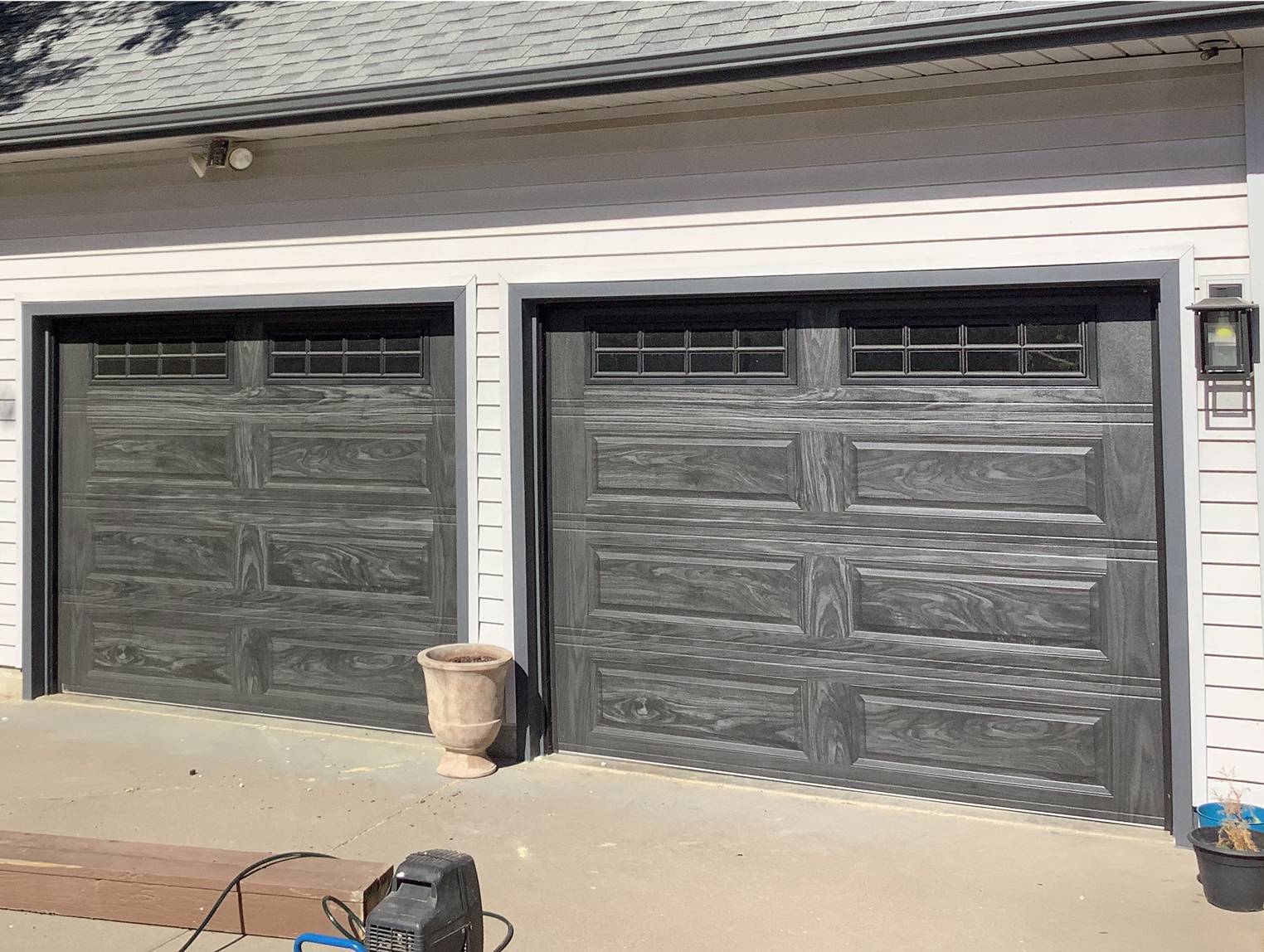 Raised panel garage door in carbon oak