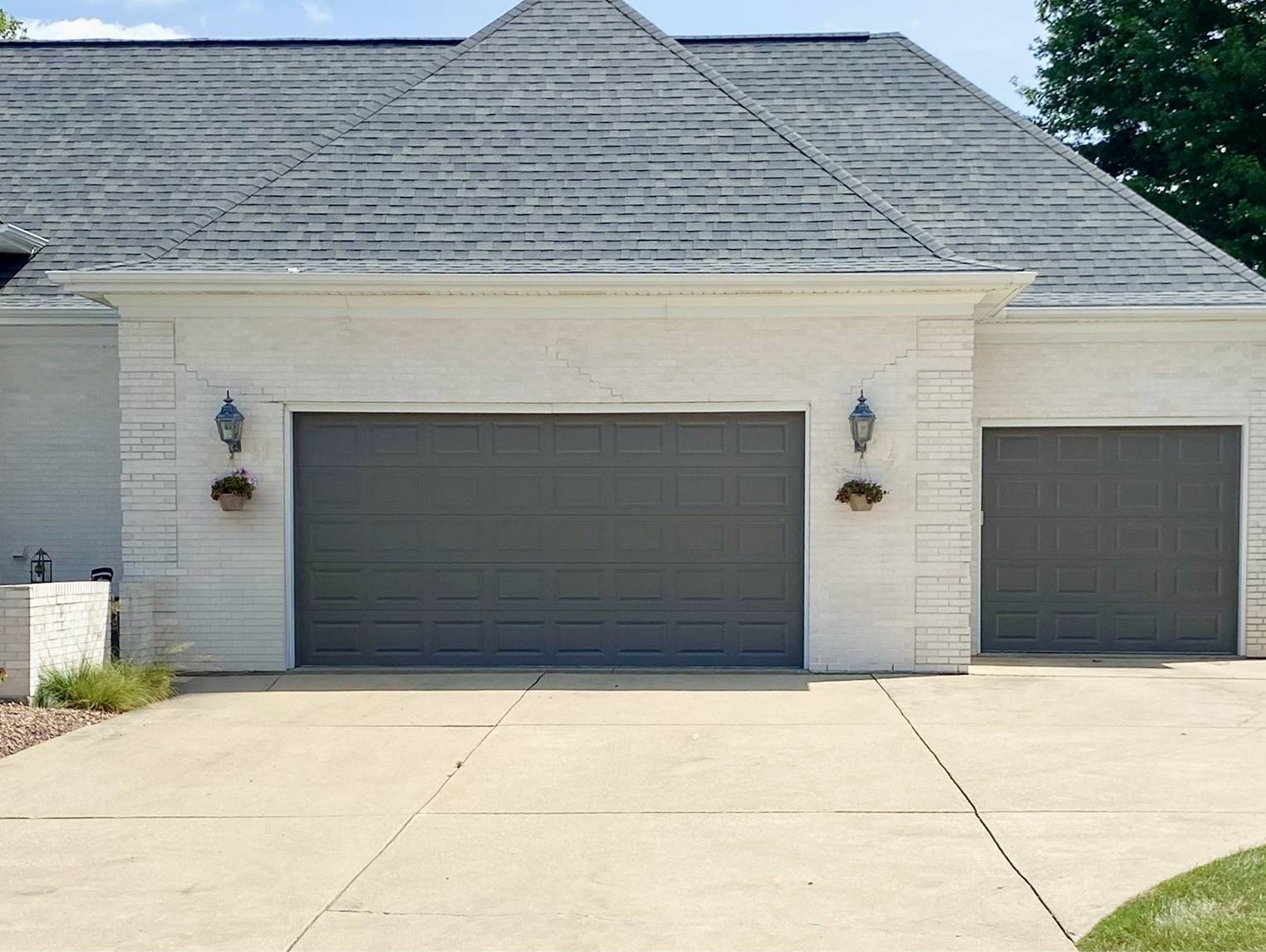 Raised panel garage doors in graphite