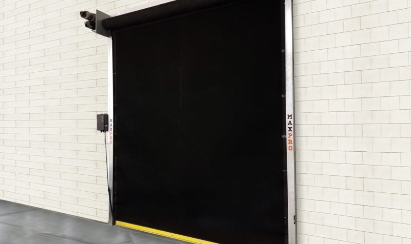 MaxPro door in white brick wall