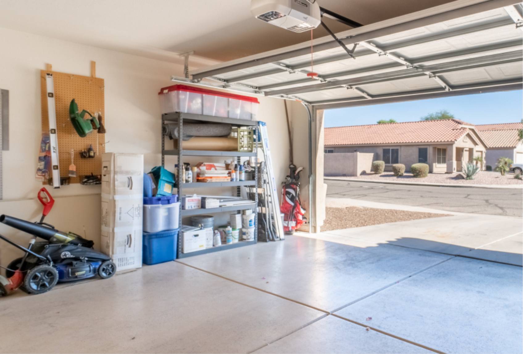 open garage door space with tools inside-large